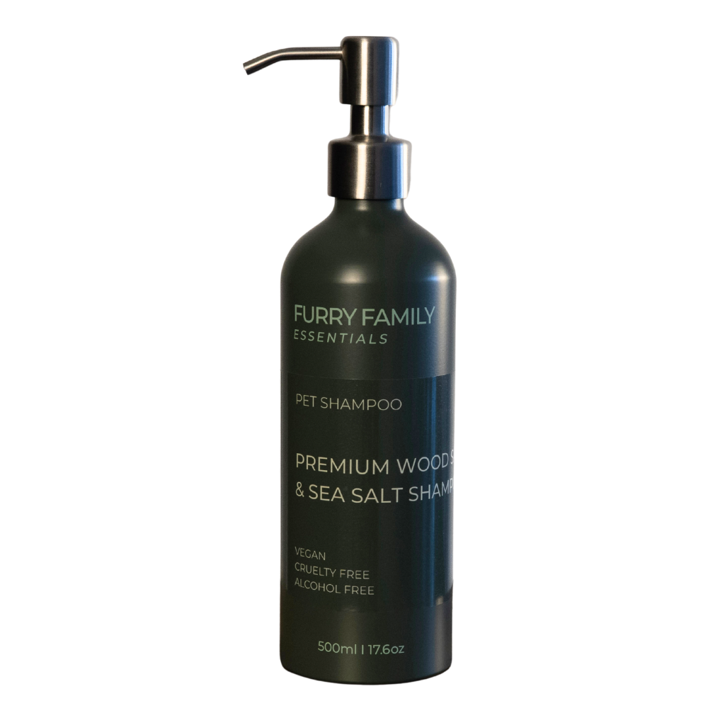 Black pet shampoo bottle with pump labeled &