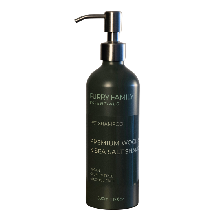 Black pet shampoo bottle with pump labeled &